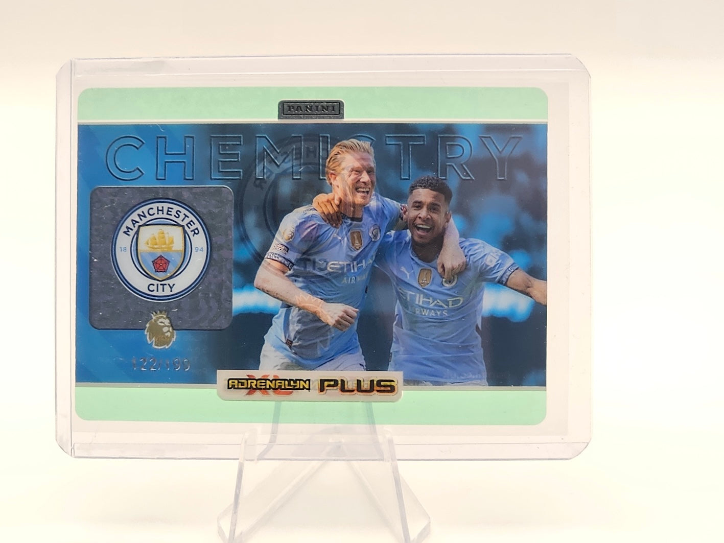 In top loader Man City Green Chemistry Numbered Card 122/199 - 2025 Adrenalyn XL PLUS Ltd